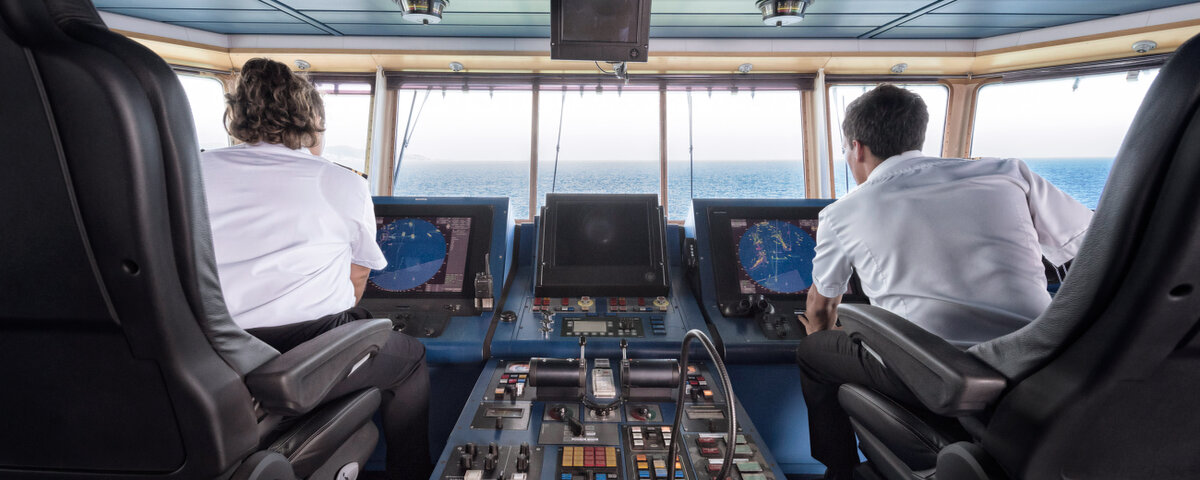 Captains on the bridge of a catamaran